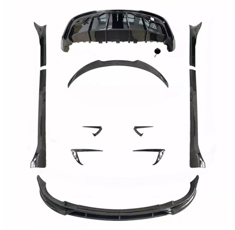Black car body kit components arranged on a white background