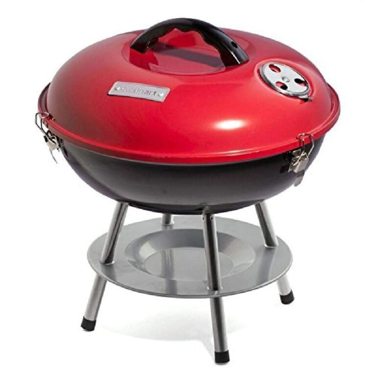 Red and black Cuisinart charcoal grill with a lid and stand