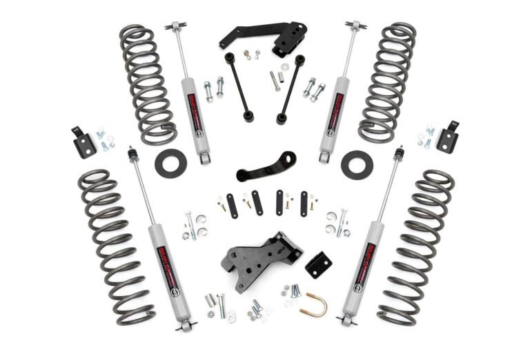 Suspension lift kit with springs, shocks, and hardware on white background