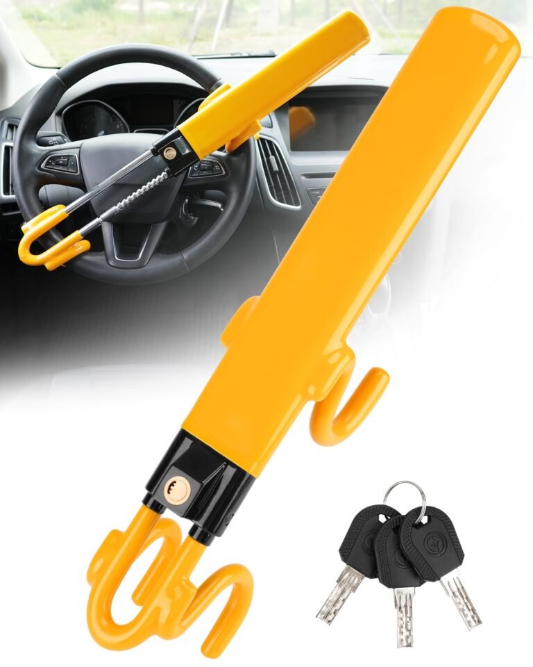 Yellow car steering wheel lock with keys, shown in front of a car