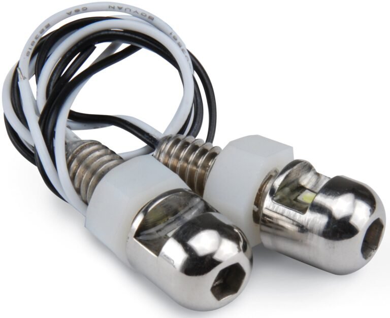 Two small LED lights with white and black wires, close-up shot