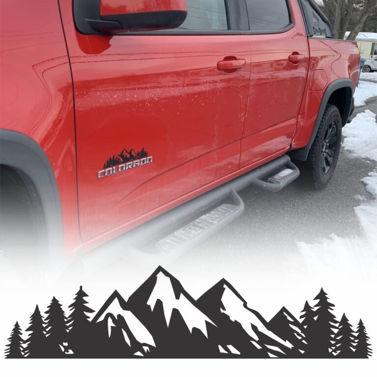 Red Colorado truck with mountain decal and step bar, snowy ground
